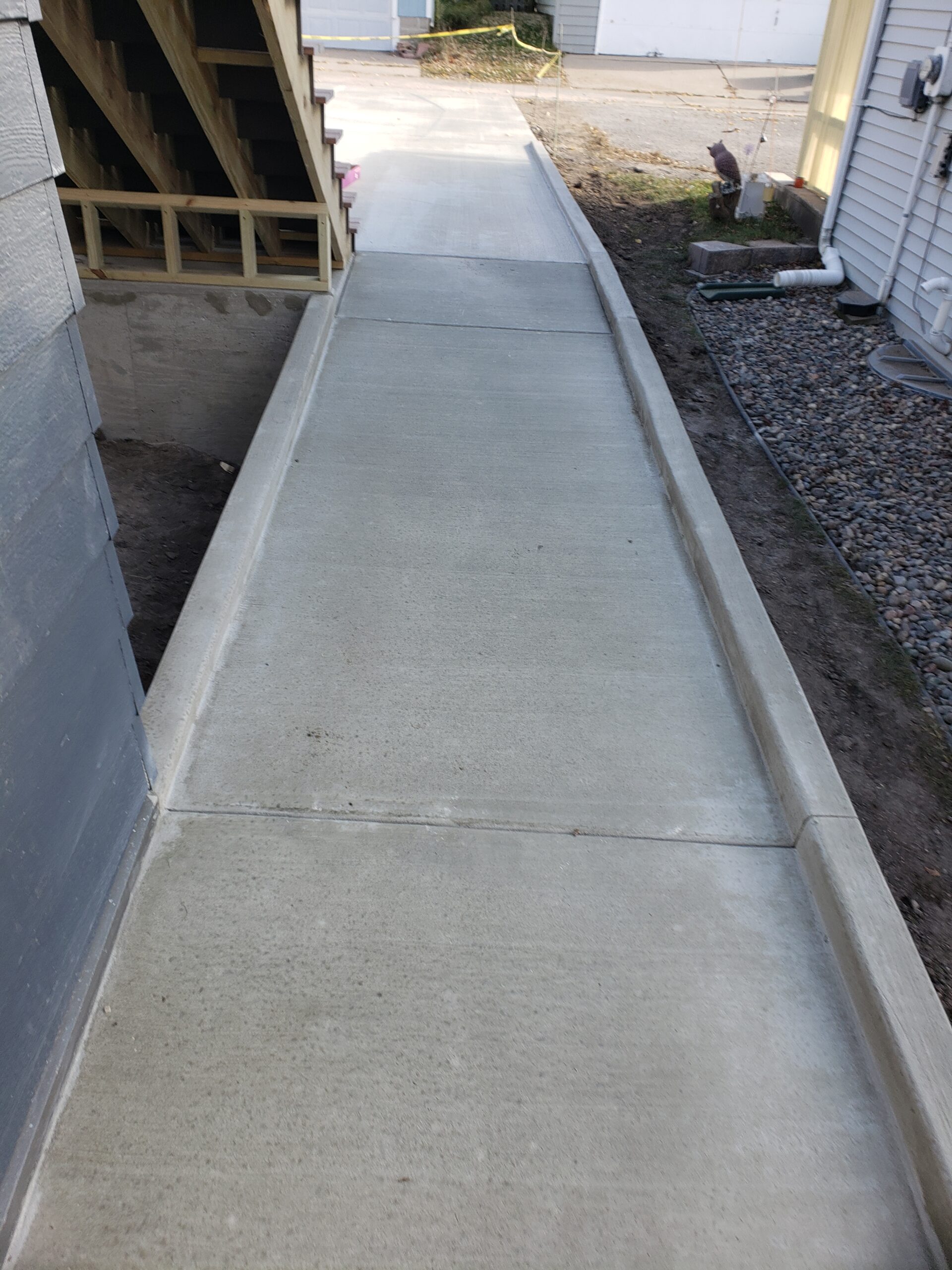 Custom sidewalk and curb pouring services for the Twin Cities metro area for homes and businesses from Voehl Construction Inc.