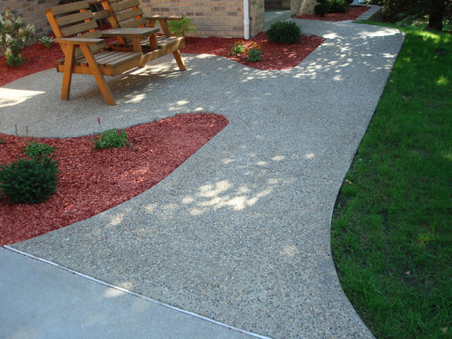 Concrete and Exposed Aggregate driveway, sidewalk and flatwork stamping, coloring, and custom finishing services for residential and commercial applications in the Twin Cities metro area from Voehl Construction Inc.