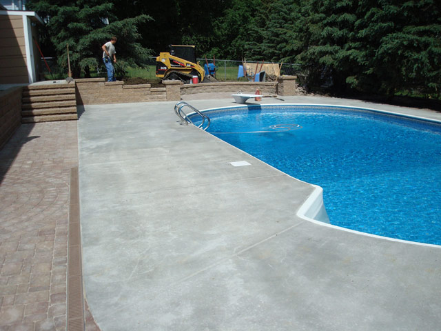 Pool deck, sidewalk, and stairs pouring and finishing for commercial and residential properties and applications in the Twin Cities metro area from Voehl Construction Inc.